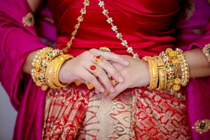 midsection-bride-wearing-jewelri
